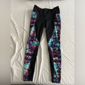 Stylish black and patterned Athleta leggings, size medium